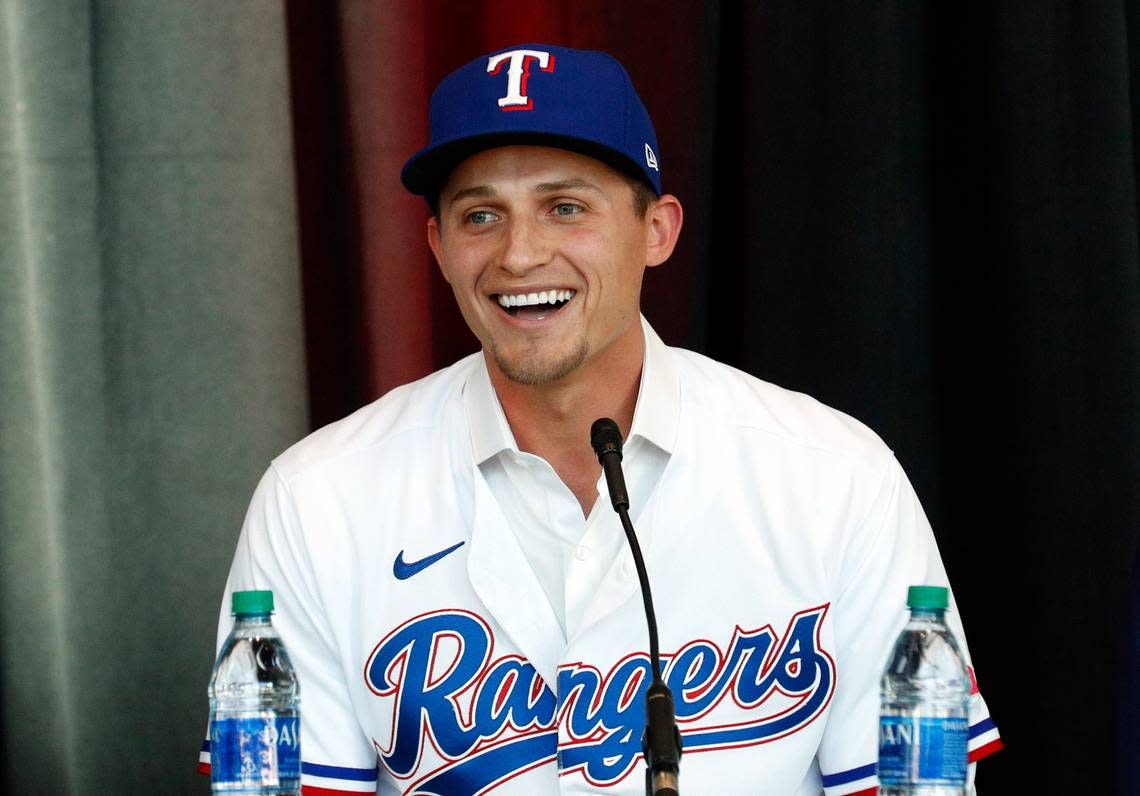 New Texas Rangers infielder Corey Seager speaks at a press conference at Globe Life Field Wednesday, Dec. 1, 2021, in Arlington, Texas. The Texas Rangers have finalized the contracts for their new half-billion dollar middle infield, wrapping up their deals Wednesday, Dec. 1, 2021 with two-time All-Star shortstop Corey Seager and Gold Glove second baseman Marcus Semien.(AP Photo/Richard W. Rodriguez)
