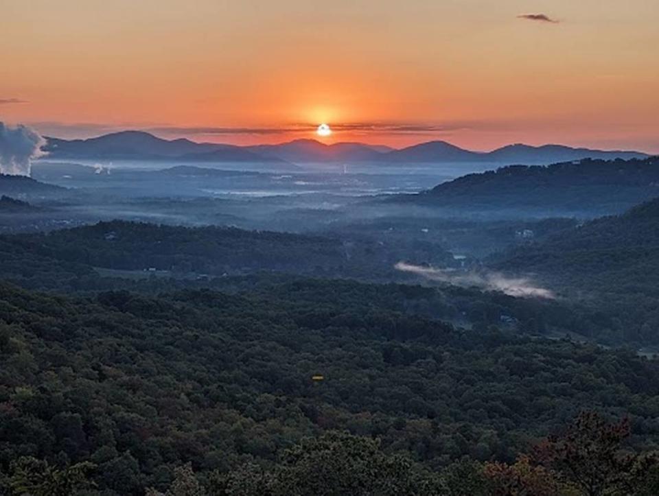 The sun rises above the mountains on Tuesday morning, Oct. 10, 2023, in this picture taken at the Chestnut Cove Overlook in Arden, Buncombe County, on the Blue Ridge Parkway. NWS employee from Morehead City, N.C./National Weather Service