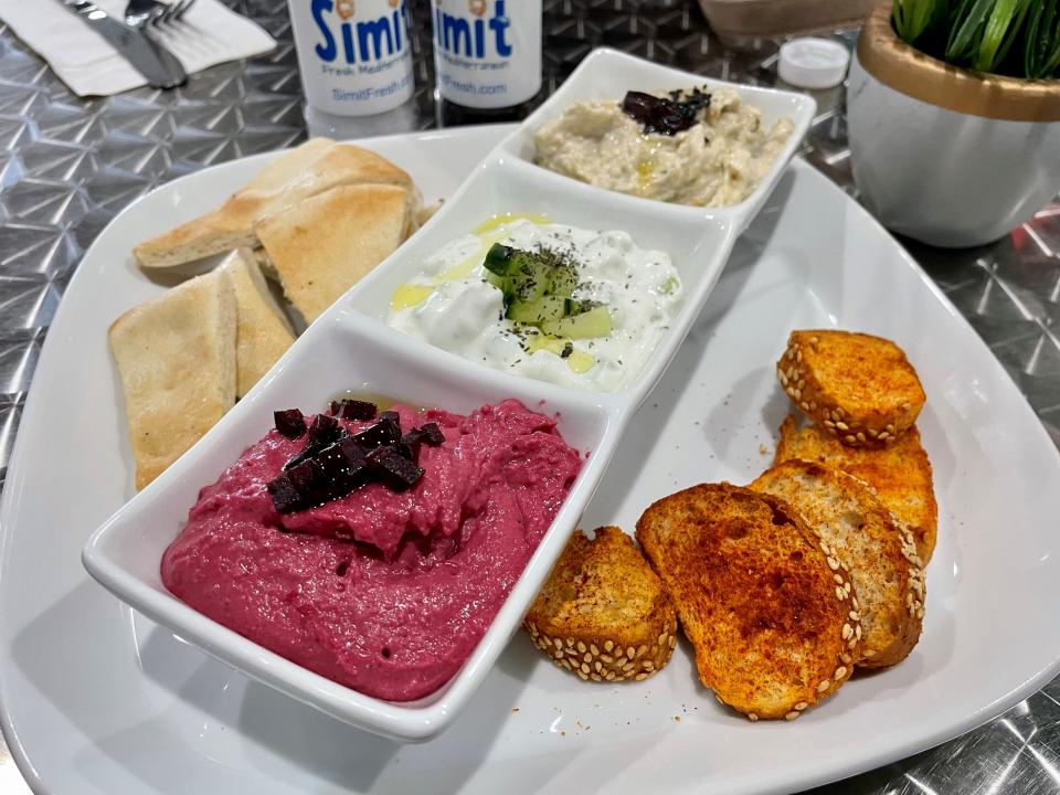 A trio of spreads ($15) at Simit in Naples included beetroot hummus, tzatziki and baba ganoush served with fresh pita and toasted simit slices.