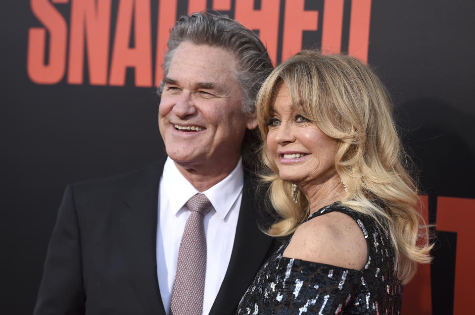 FILE - Kurt Russell, left, and Goldie Hawn appear at the premiere of Hawn's film, "Snatched" in Los Angeles on May 10, 2017. Russell and Hawn star in the holiday film "The Christmas Chronicles: Part Two," premiering Friday on Netflix. (Photo by Jordan Strauss/Invision/AP, File)