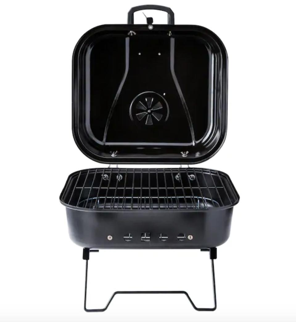 This charcoal grill has folding legs and a locking lid that make it easy to carry around. <br /><br /><strong><a href="https://go.skimresources.com?id=38395X987171&amp;xs=1&amp;xcust=portablegrills-KristenAiken-061121-&amp;url=https%3A%2F%2Fwww.lowes.com%2Fpd%2FMr-Bar-B-Q-Portable-charcoal-grill-206-sq-in-Black-Porcelain-Coated-Portable-Charcoal-Grill%2F1000714194%3Fcm_mmc%3Daff-_-c-_-prd-_-mdv-_-gdy-_-all-_-0-_-27795-_-0%26placeholder%3Dnull%26gclid%3DEAIaIQobChMIu9--qPip6gIVD4zICh2HVwpoEAQYBSABEgII6PD_BwE%26gclsrc%3Daw.ds%26irclickid%3DzlAV9VUedxyLTodwUx0Mo37mUkBwvCwGP2eB0s0%26irgwc%3D1" target="_blank" rel="noopener noreferrer">Find it for $20 at Lowe's</a></strong>.
