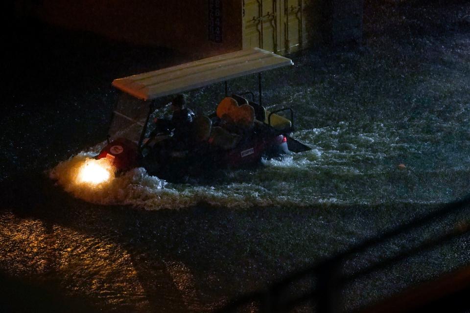 Sep 1, 2021; Flushing, NY, USA; A golf cart drives through flood water outside Louis Armstrong Stadium on day three of the 2021 U.S. Open tennis tournament at USTA Billie Jean King National Tennis Center.