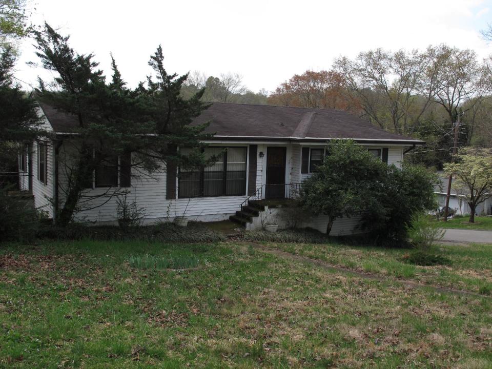 In this Thursday, April 3, 2014 photo, a home is shown where the skeletal remains of 63-year-old twin brothers were found on March 29, in Chattanooga, Tenn., when police made a welfare check. Each man was found seated in an easy chair inside the modest home they shared for decades, and where they apparently died together about three years ago. (AP Photo/Adrian Sainz)