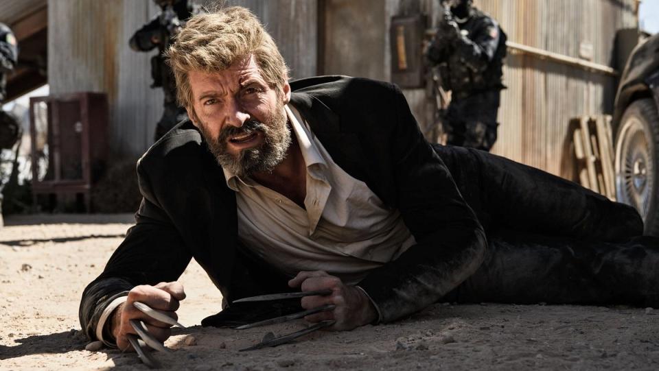 Hugh Jackman, looking old and disheveled, gets up from the desert dust in Logan.