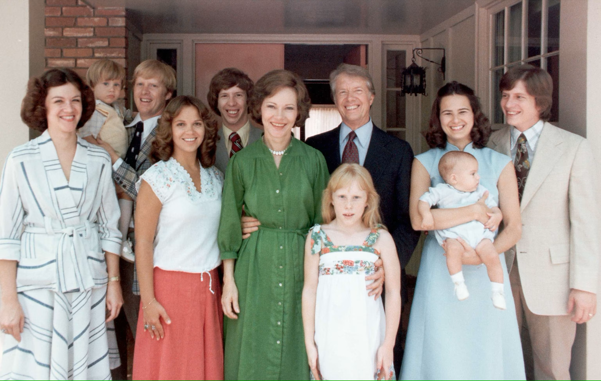 Rosalynn Carter and her family. Left to right: Judy (Jack Carter’s wife); Jason James Carter; Jack Carter; Annette ( Jeff Carter’s Wife); Jeff  Carter; Rosalynn Carter; Amy Carter; Jimmy Carter; Caron Griffin Carter(Chip Carter’s wife) holding James Earl Carter IV; Chip Carter (Corbis via Getty Images)