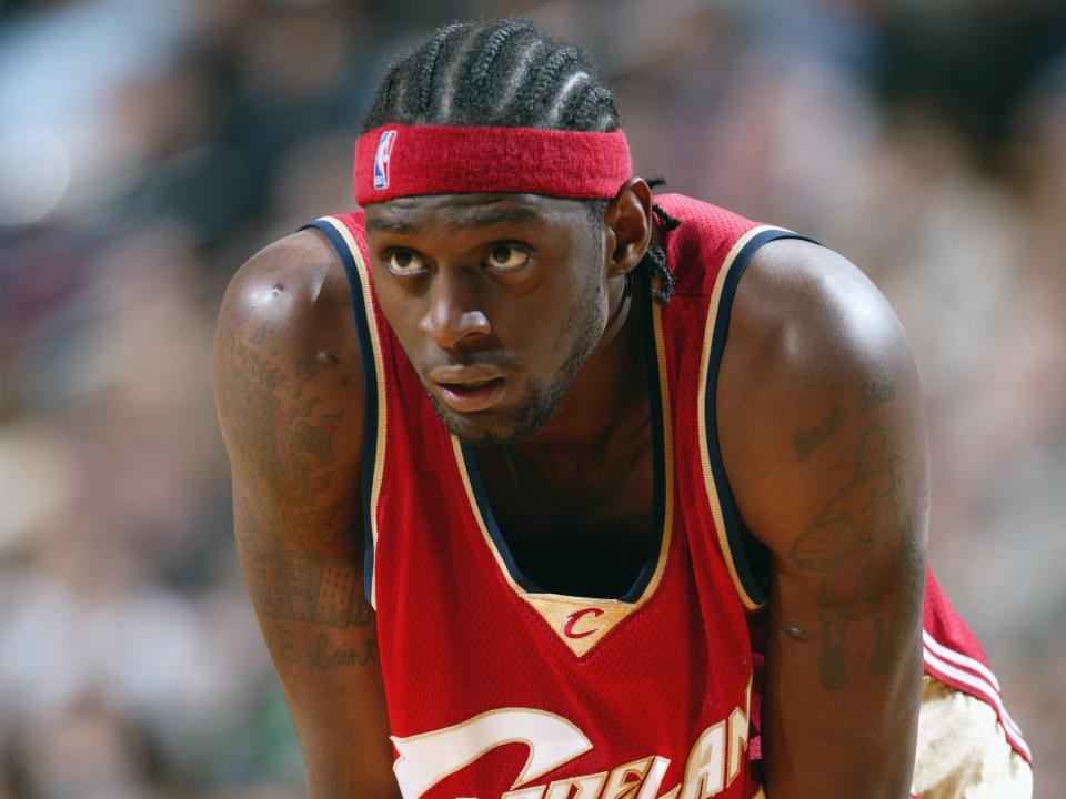Darius Miles rests his hands on his knees during a game in 2003.