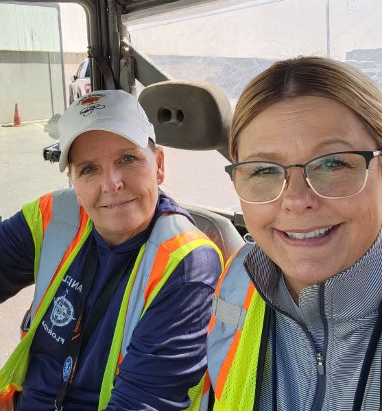 Penny Cauzillo of Canton, left, and her sister Wendy Kroll of Chesterfield, work together at the Dearborn Truck Plant on the launch of the 2024 Ford F-150.