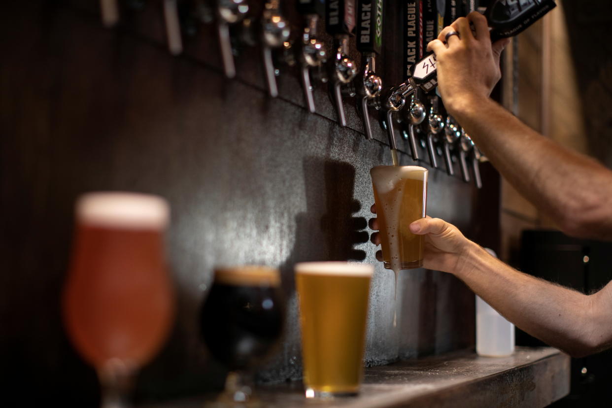 Beer is poured from a tap at Black Plague Brewery during the outbreak of the coronavirus disease (COVID-19) in Oceanside, California, U.S., October 15, 2020. REUTERS/Mike Blake