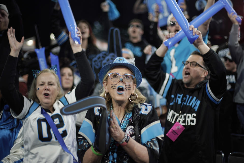 Carolina Panthers fans cheer during the second round of the NFL football draft, Friday, April 28, 2023, in Kansas City, Mo. (AP Photo/Charlie Riedel)