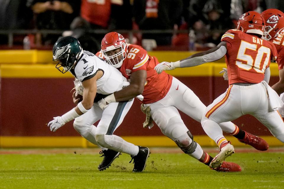 Philadelphia Eagles quarterback Jalen Hurts (1) is sacked by Kansas City Chiefs defensive tackle Chris Jones (95) during the first half of an NFL football game, Monday, Nov. 20, 2023, in Kansas City, Mo.