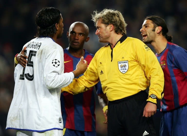 Referee Anders Frisk sends off Didier Drogba (L) of Chelsea during a Champions League match in February 2005