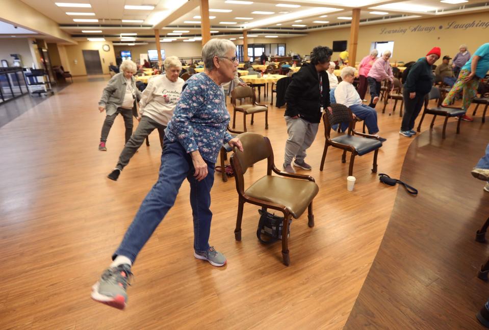 Judy Buck of Zanesville does an exercise during an arthritis class at the Muskingum County Center for Seniors recently.