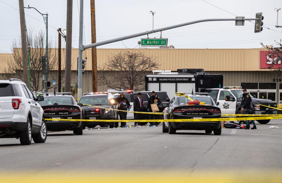 Law enforcement investigates the scene of a homicide in Salinas, Calif., on Saturday, Feb. 26, 2022.  