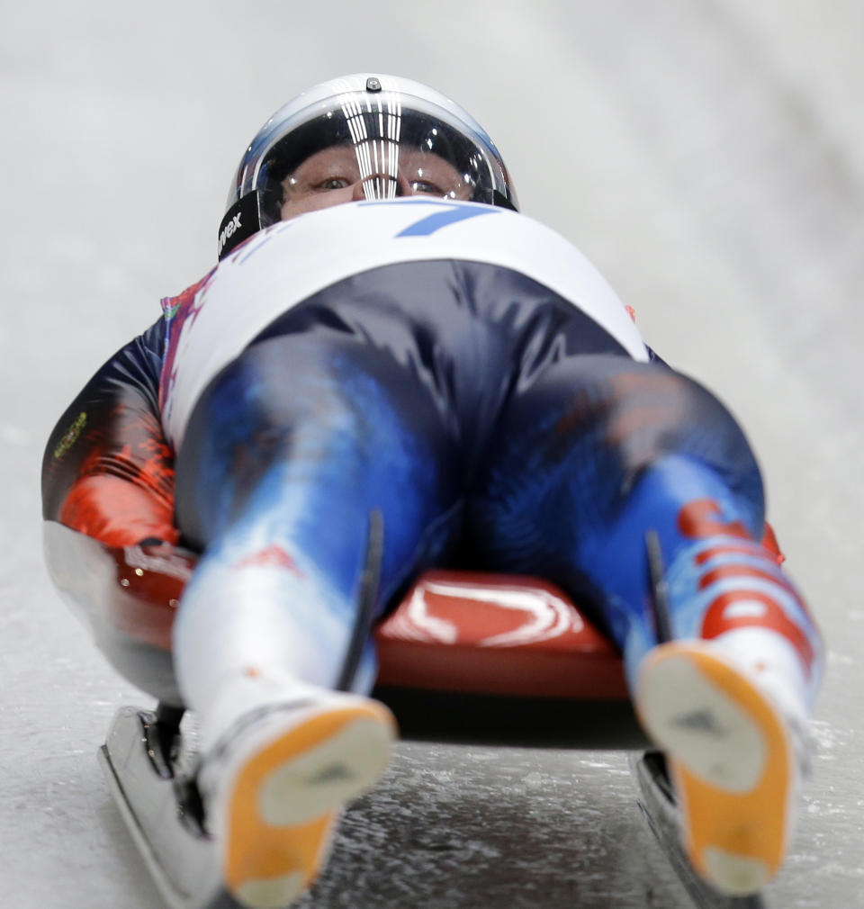 Albert Demchenko of Russia starts his second run during the men's singles luge competition at the 2014 Winter Olympics, Saturday, Feb. 8, 2014, in Krasnaya Polyana, Russia. (AP Photo/Natacha Pisarenko)