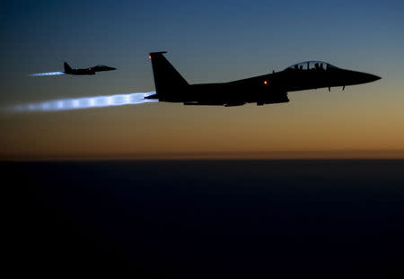 A pair of U.S. Air Force F-15E Strike Eagles fly over northern Iraq after conducting airstrikes in Syria, in this U.S. Air Force handout photo taken early in the morning of September 23, 2014. REUTERS/U.S. Air Force/Senior Airman Matthew Bruch/Handout