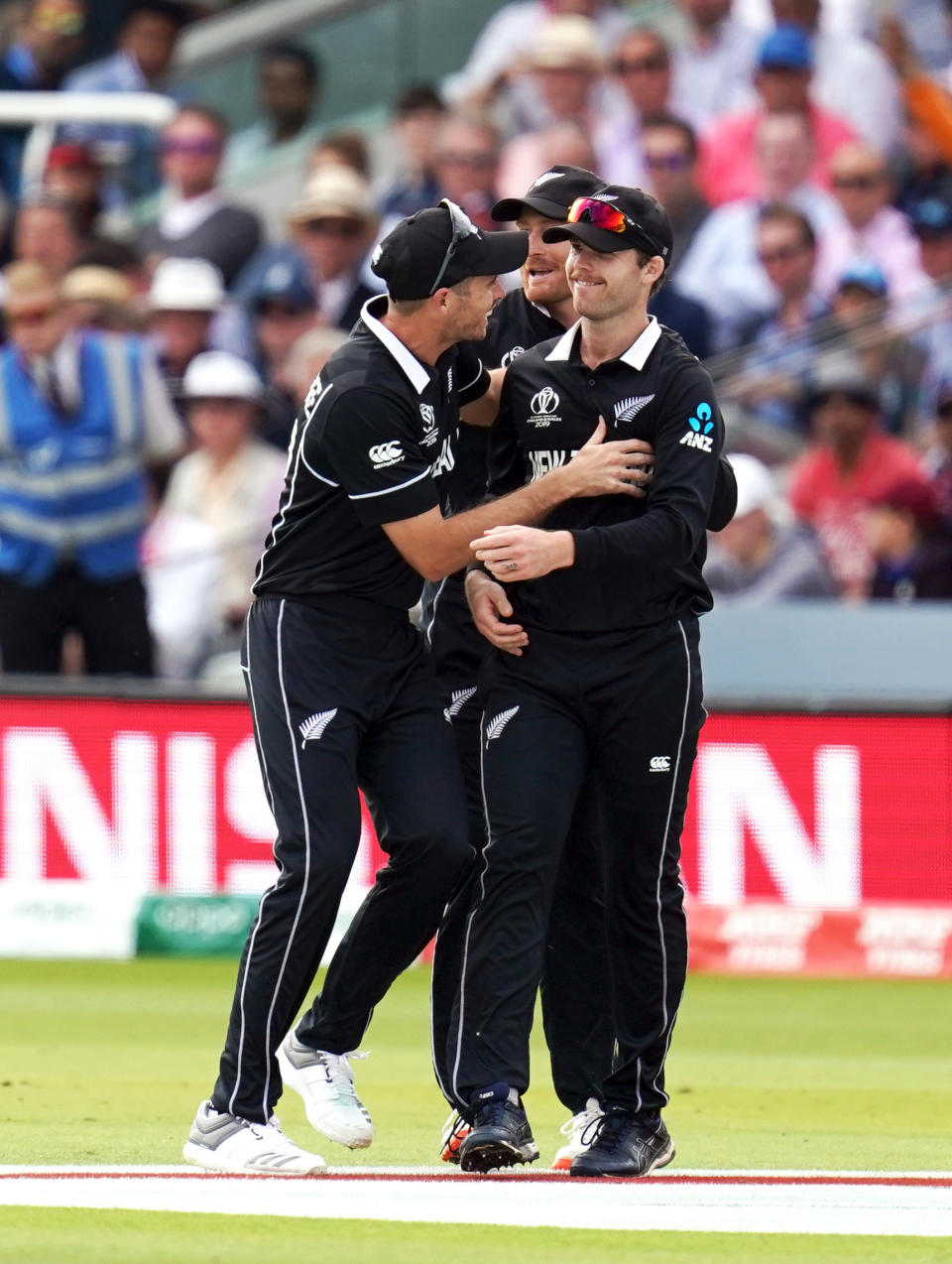 New Zealand's Lockie Ferguson (right) celebrates with team-mates after catching out England's Eoin Morgan during the ICC World Cup Final at Lord's, London.