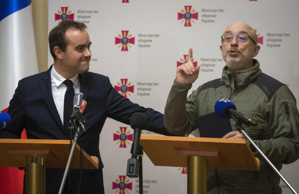 French Defense Minister Sebastien Lecornu, left, and his Ukrainian counterpart Oleksii Reznikov attend a joint press conference in Kyiv, Ukraine, Wednesday, Dec. 28, 2022. (AP Photo/Efrem Lukatsky)