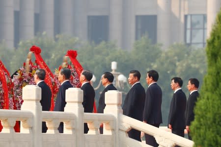 Chinese President Xi and Politburo Standing Committee members attend a wreath laying ceremony at the Monument to the People's Heroes in Tiananmen Square in Beijing