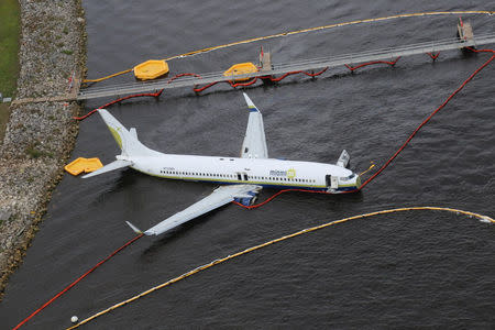Aerial view of the Miami Air International Boeing 737-800 that overran the runway at NAS Jacksonville and came to rest in the St Johns River in Jacksonville, Florida, U.S., May 4, 2019. NTSB/Handout via REUTERS
