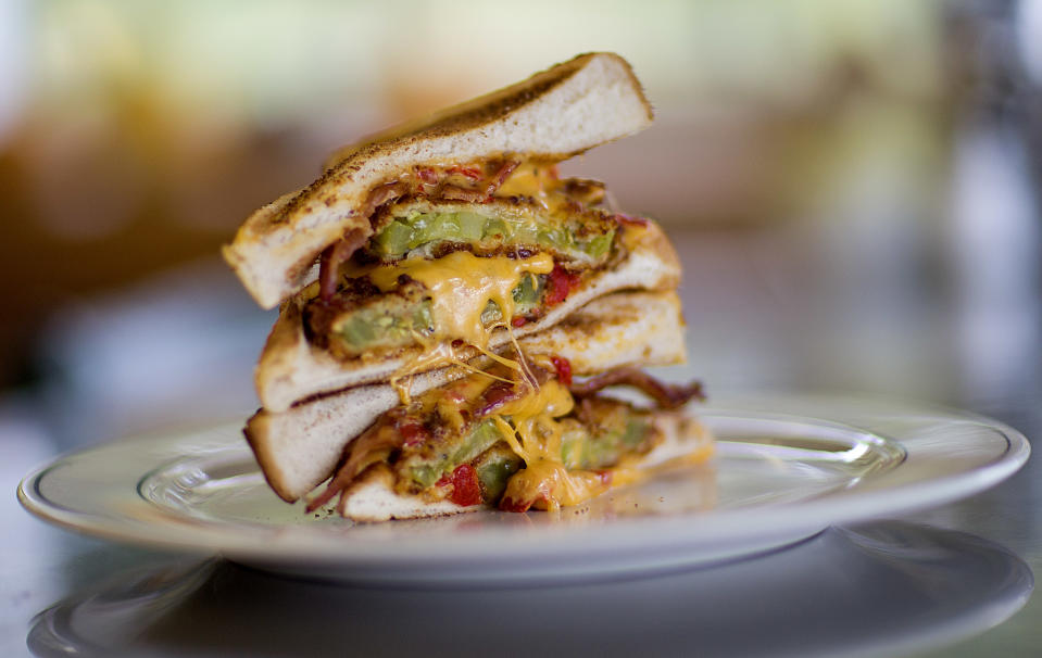 The Grant Stack, a sandwich made with Texas toast, fried green tomatoes, bacon and pimento cheese, is photographed at the Home grown restaurant, Tuesday, Oct. 22, 2013, in Atlanta. Home grown offers locally sourced Southern dishes for breakfast and lunch in a quirky, no-frills setting that feels comfortable no matter who you are. (AP Photo/David Goldman)