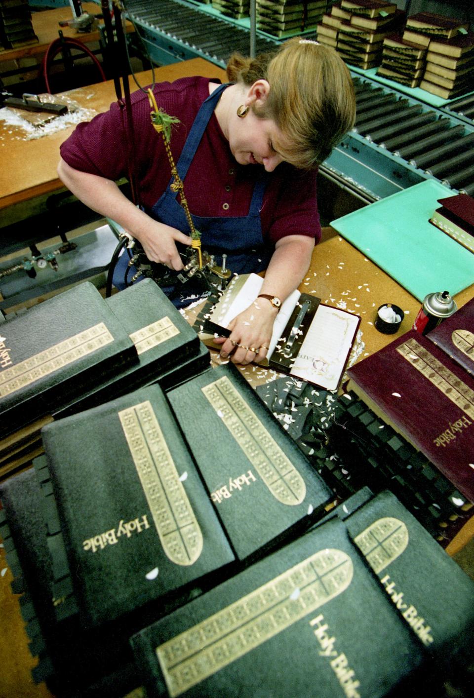 Susie Daniel cuts thumb indexes in a Bible at the Thomas Nelson Inc. plant in Nashville Feb. 28, 1996. The company is the largest producer of Bibles in the United States.