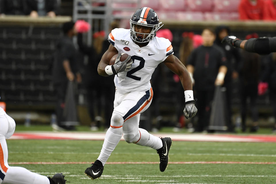 FILE - In this Oct. 26, 2019, file photo, Virginia wide receiver Joe Reed (2) runs against Louisville during the first half of an NCAA college football game in Louisville, Ky. Reed was selected to The Associated Press All-Atlantic Coast Conference football team, Tuesday, Dec. 10, 2019. (AP Photo/Timothy D. Easley, File)