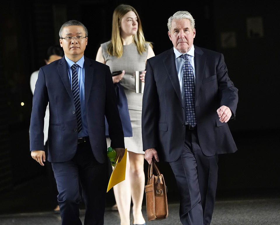 Former Minneapolis police officer Tou Thao, left, and his attorney Robert Paule arrive for sentencing for violating George Floyd's civil rights outside the Federal Courthouse Wednesday, July 27, 2022 in St. Paul, Minn. The last two former Minneapolis police officers who were convicted of violating George Floyd’s civil rights have been sentenced in federal court. J. Alexander Kueng was sentenced Wednesday to three years and Thao got a 3 1/2-year sentence. They were convicted in February of two counts of violating Floyd’s civil rights. (David Joles/Star Tribune via AP)