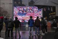 Fans watch a broadcast of the United States World Cup soccer game against Netherlands at the Oculus Plaza, Saturday, Dec. 3, 2022, New York. (AP Photo/Yuki Iwamura)