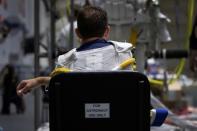 NASA Commercial Crew Astronaut Josh Cassada stretches before being placed into his space suit at NASA's Neutral Buoyancy Laboratory (NBL) training facility near the Johnson Space Center in Houston,