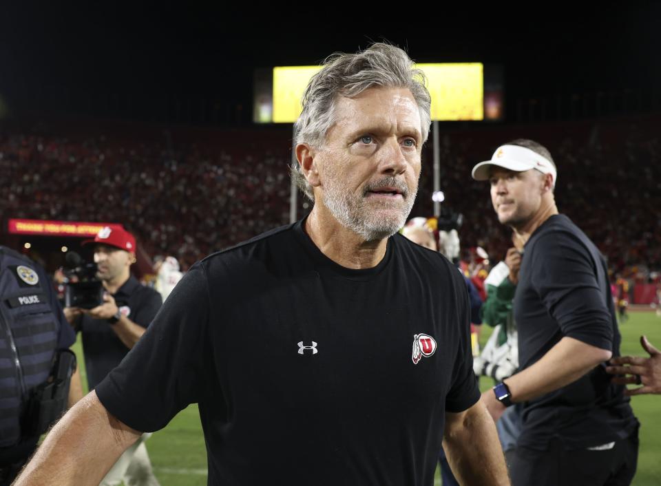 Utah Coach Kyle Whittingham walks away after being congratulated by USC Coach Lincoln Riley after Utah’s win at the Los Angeles Memorial Coliseum on Saturday, Oct. 21, 2023.