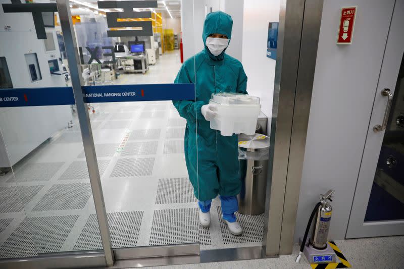 A employee works at a clean room of National Nanofab Center in Daejeon