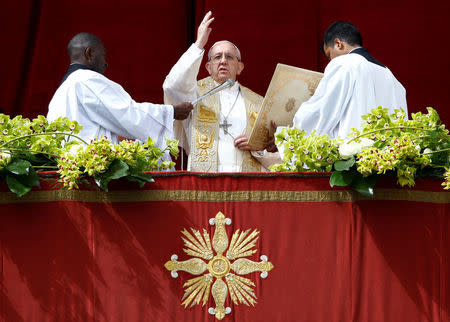 Pope Francis delivers his Easter message in the Urbi et Orbi (to the city and the world) address from the balcony overlooking St. Peter's Square at the Vatican April 1, 2018. REUTERS/Stefano Rellandini