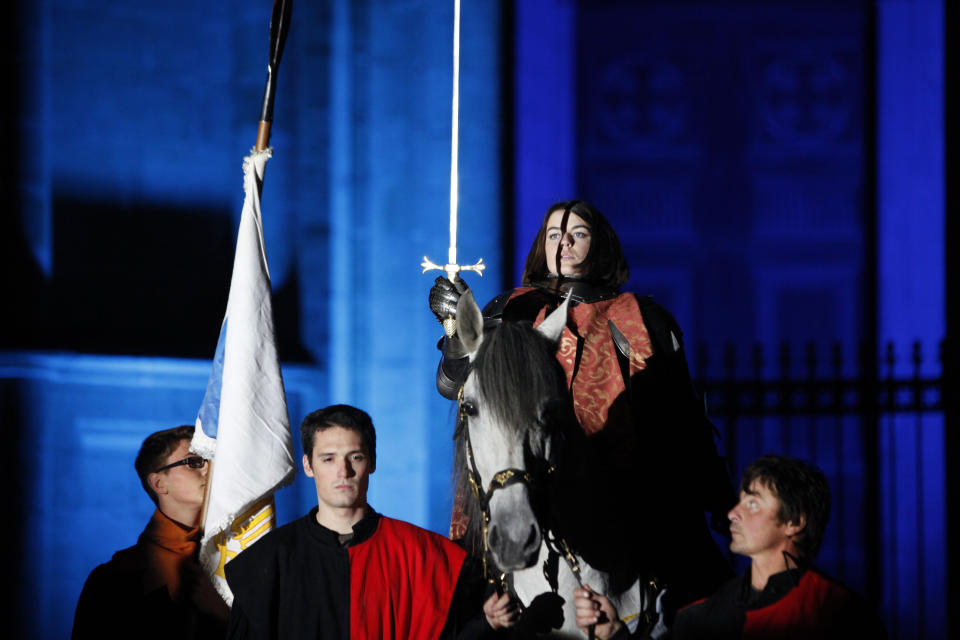 Pauline Finet performs as Joan of Arc during the opening ceremony of the 600th anniversary of the birth of Joan of Arc, in Orleans, central France, Sunday April 29, 2012. The city of Orleans goes all out with celebrations marking the 600th birthday of Joan of Arc, a national icon and symbol of French resistance through the ages at a time when French identity and France's role in the world are a focus in the presidential campaign. (AP Photo/Thibault Camus)