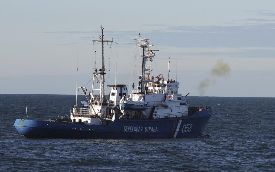 Handout photo of Russian Coast Guard vessel firing warning shot as Greenpeace International activists protest near a Gazprom oil platform in the Pechora Sea