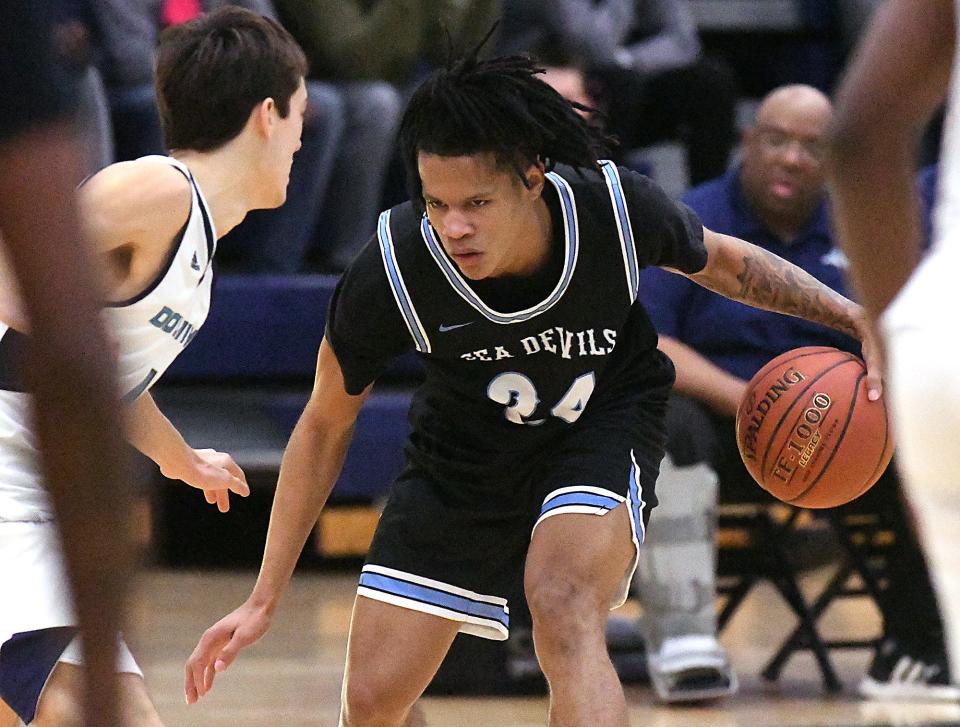 Cape Fear Community College's Jajuan Carr takes on his defender during the Sea Devils win over Brunswick Community College last week. Carr is rejuvenated after a difficult first year of college basketball at UNCW.   [KEN BLEVINS/STARNEWS]