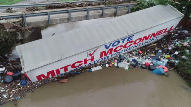 A trailer promoting U.S. Senate Republican leader Mitch McConnell lies in a waterway due to flooding in Whitesburg, Kentucky, on July 29. (Photo: Scott Utterback/USA Today Network/REUTERS)