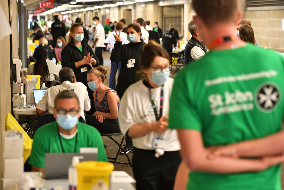 People queue up to receive a coronavirus vaccination at Twickenham rugby stadium, south-west London, where up to 15,000 doses are ready to be administered at the walk-in centre which has been set up for residents of north-west London in response to an increase in the number of cases of coronavirus in the area. Picture date: Monday May 31, 2021. (Photo by Dominic Lipinski/PA Images via Getty Images)