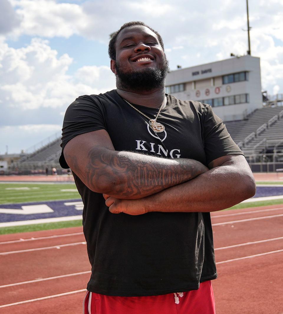 Ohio State offensive lineman Dawand Jones poses at Ben Davis' football stadium on April 14.