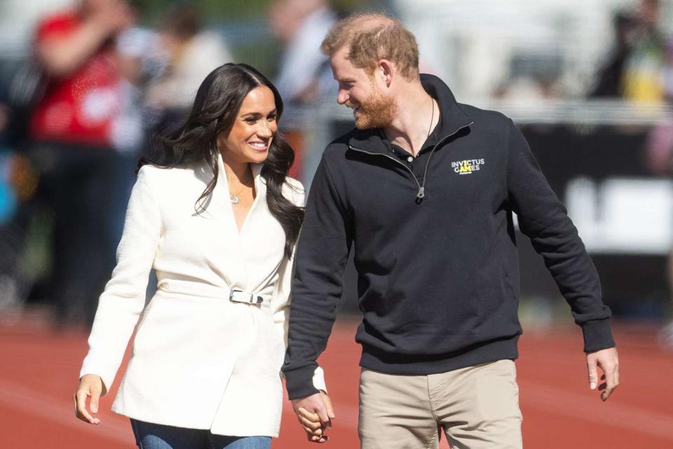 <p>Samir Hussein/WireImage</p> Meghan Markle and Prince Harry at the Invictus Games in The Hague in April 2022.