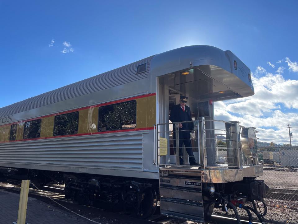 A train conductor steps off the train in Williams, Arizona.