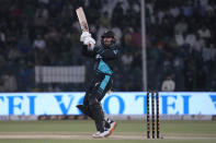 New Zealand's Tom Blundell follows the ball after playing a shot for boundary during the fourth T20 international cricket match between Pakistan and New Zealand, in Lahore, Pakistan, Thursday, April 25, 2024. (AP Photo/K.M. Chaudary)