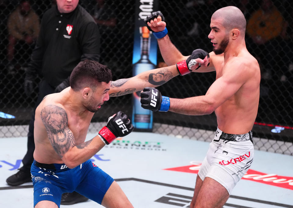 LAS VEGAS, NEVADA – MARCH 02: (L-R) Alex Perez punches Muhammad Mokaev of Russia in a flyweight bout during the UFC Fight Night event at UFC APEX on March 02, 2024 in Las Vegas, Nevada. (Photo by Jeff Bottari/Zuffa LLC via Getty Images)