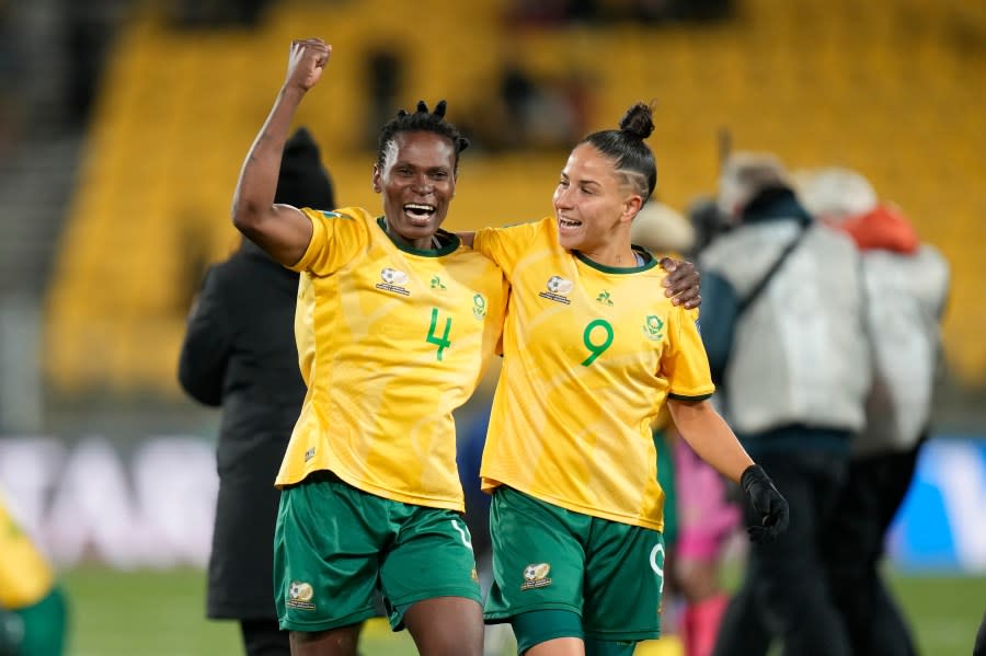 South Africa’s Noko Matlou, left, and South Africa’s Gabriela Salgado celebrate after the Women’s World Cup Group G soccer match between South Africa and Italy in Wellington, New Zealand, Wednesday, Aug. 2, 2023. (AP Photo/Alessandra Tarantino)