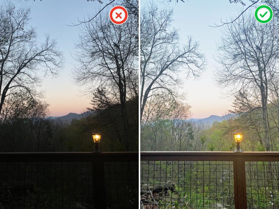 Left: Dark image of a fence with a light on in front of trees and a mountain at sunset.  Right: same illuminated image.