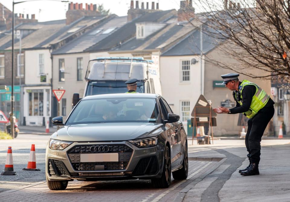 Police at a vehicle checkpoint in York where officers from North Yorkshire Police were ensuring that motorists and their passengers are complying with government restrictions on 26 MarchPA