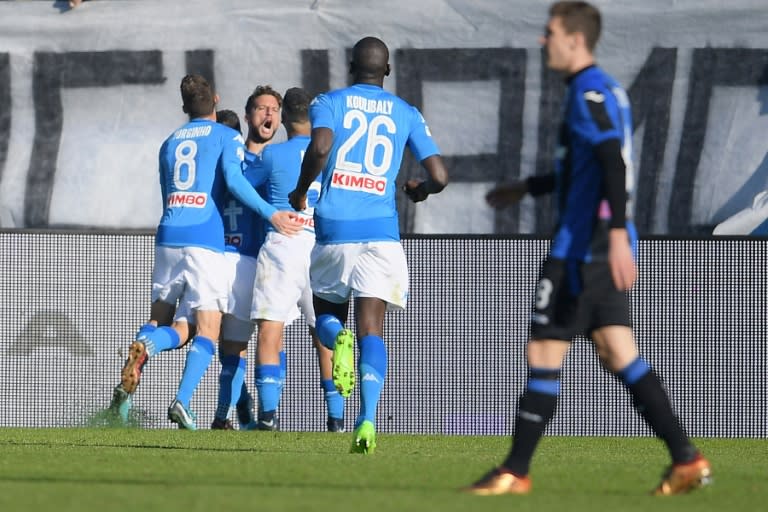 Napoli's forward Dries Mertens (2nd L) celebrates with teammates after scoring against Atalanta on January 21, 2018