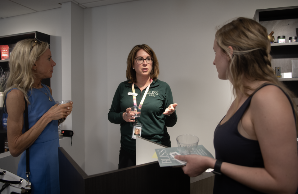 Pamela Siekman, Bliss Ohio owner, talks with guests at an open house Friday at the new medical marijuana dispensary in Kent.