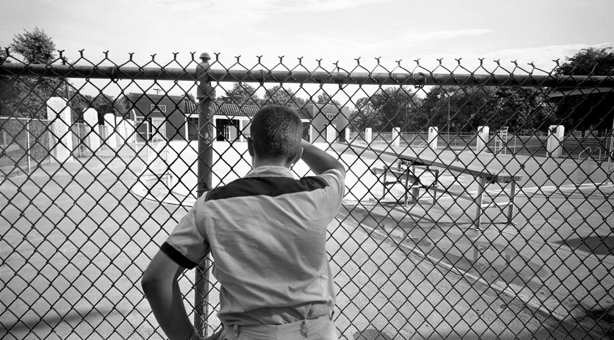 A youngster could only look in at the closed swimming pool at Centennial Park Aug. 2, 1961. The city of Nashville closed its four large swimming pools and the 19 free, smaller pools because of financial reasons, but the "Whites Only" pools were shut down in response to efforts to desegregate them. That was a common practice in the South.