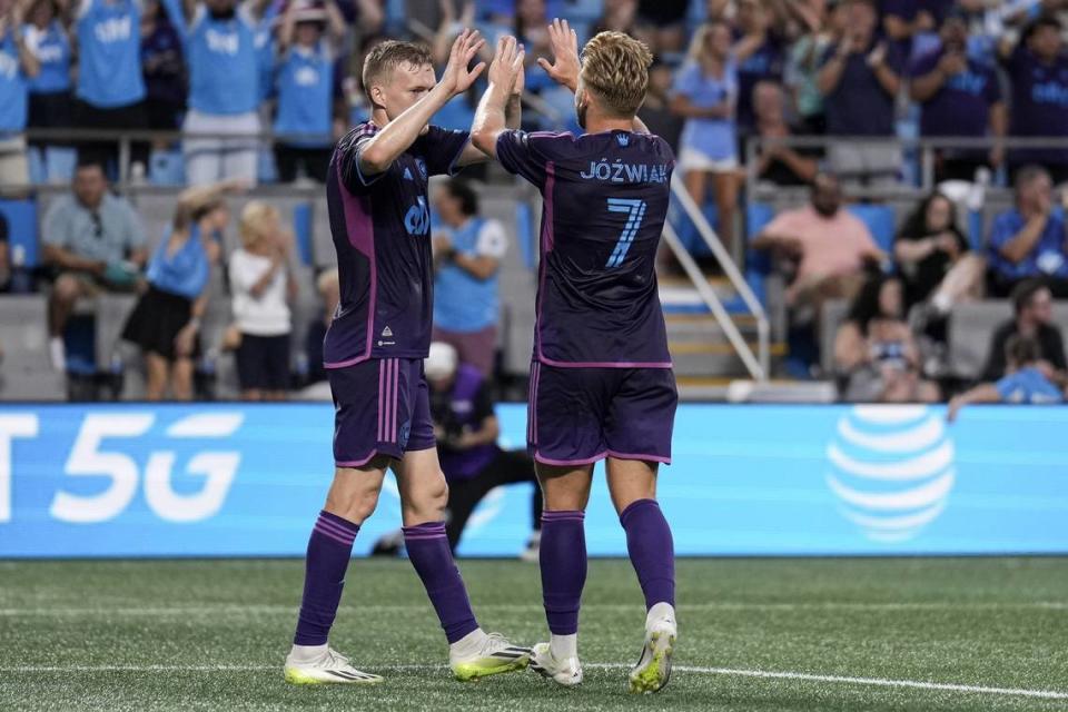 Jul 29, 2023; Charlotte, NC, USA; Charlotte FC forward Karol Swiderski (11) celebrates with midfielder Kamil Jozwiak (7) after scoring a goal against Necaxa during the first half at Bank of America Stadium. Mandatory Credit: Jim Dedmon-USA TODAY Sports