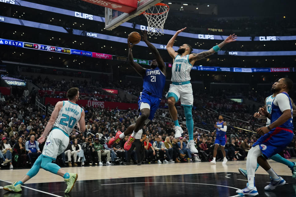 Los Angeles Clippers guard Kobe Brown (21) shoots against Charlotte Hornets forward Cody Martin (11) during the first half of an NBA basketball game in Los Angeles, Tuesday, Dec. 26, 2023. (AP Photo/Ashley Landis)